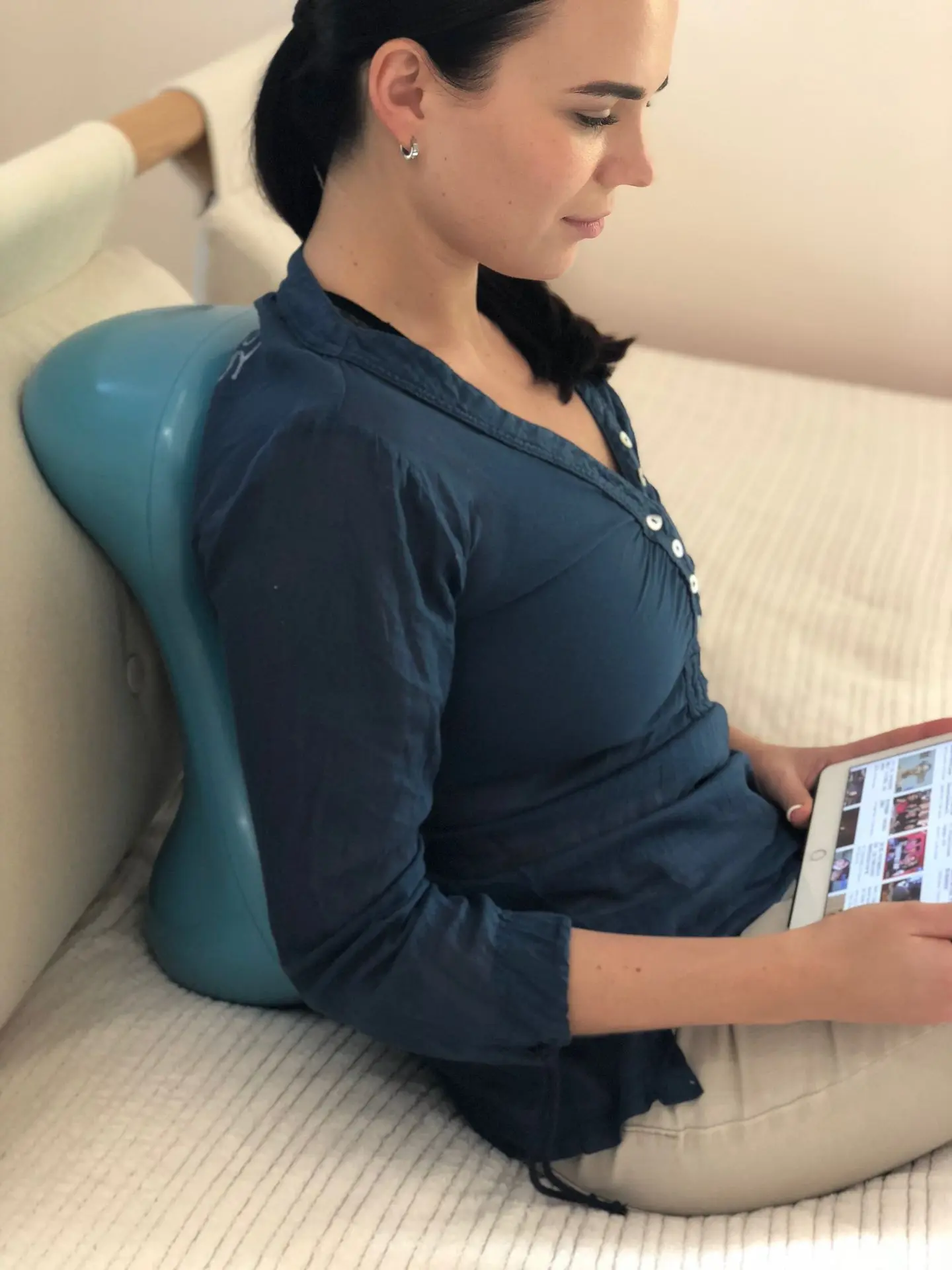 Woman watching her iPad while leaning her back against an Air8