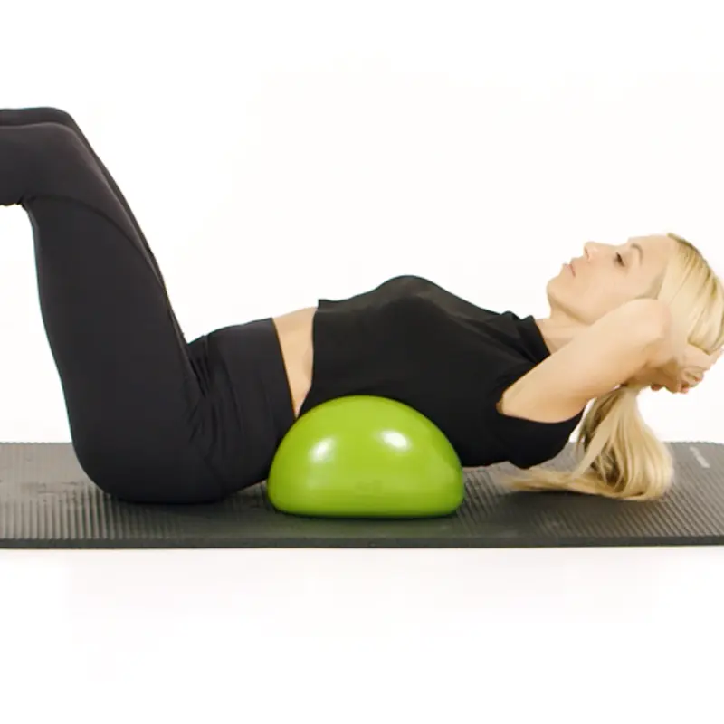 Blonde girl in back position on a green Air8 doing abdominal exercises