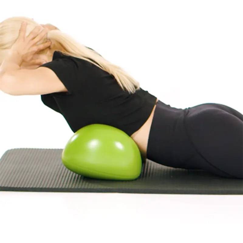 Fitness model lying in chest position on a green Air8 Cushion