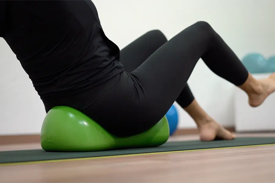 Person doing fitness in the studio with a green Air8
