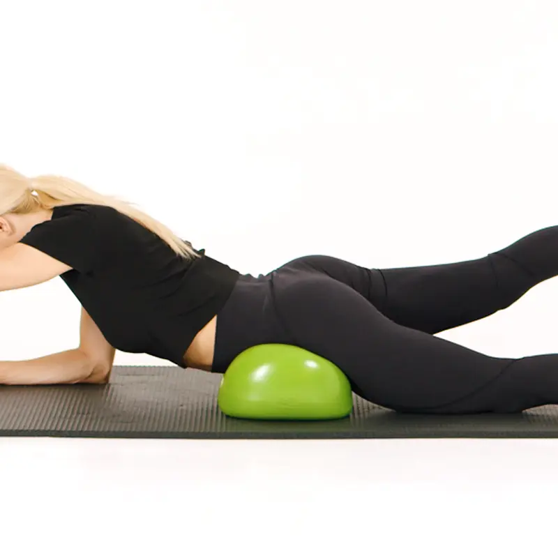 Lady in pelvic position on green Air8 Cushion training glutes on a yoga mat