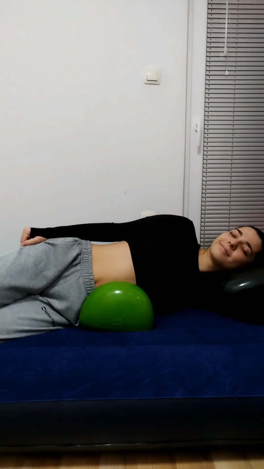 Girl relaxing on a bed with 2 Air8 Cushions